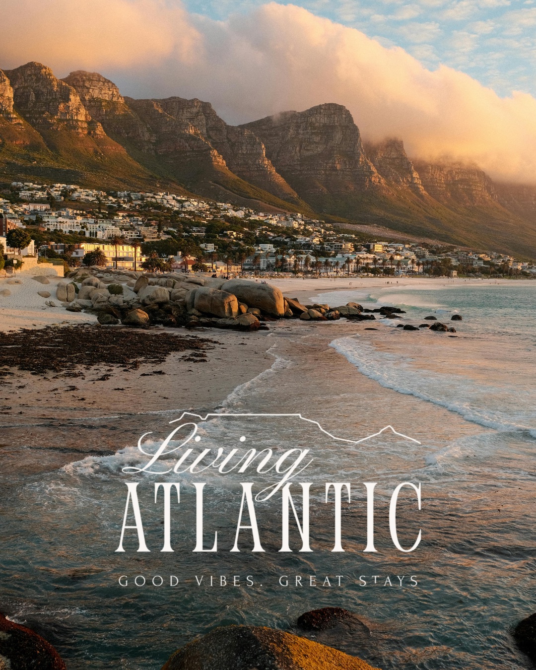 Living Atlantic brand logo over a sunset view of Camps Bay beach and the Twelve Apostles.