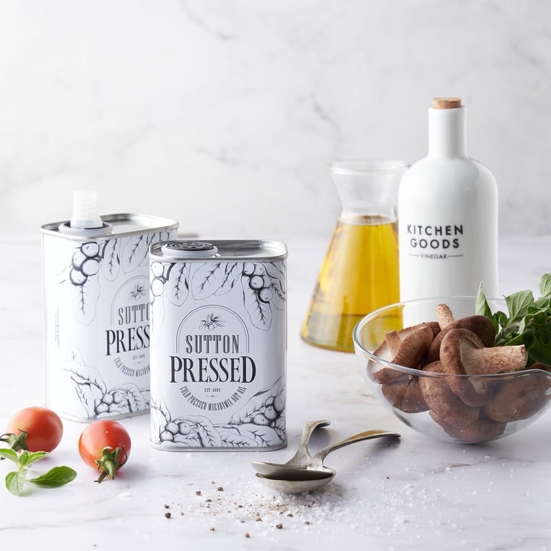 Sutton Pressed macadamia oil tins styled with mushrooms, tomatoes and Kitchen Goods vinegar.